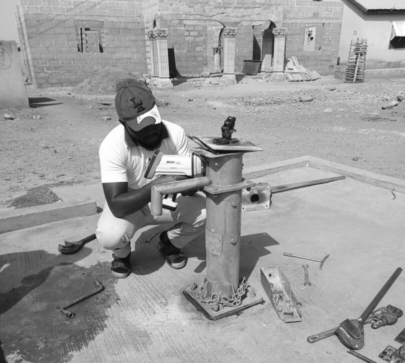 A man installing a water pump.
